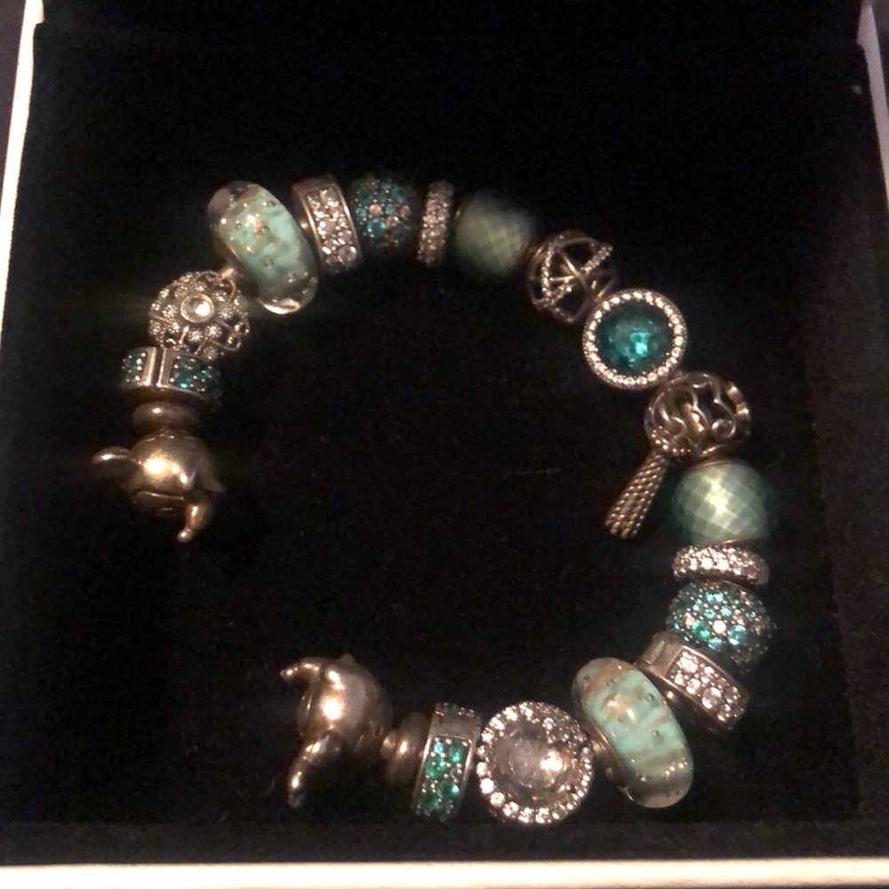 Beautiful green and silver Pandora bracelet.